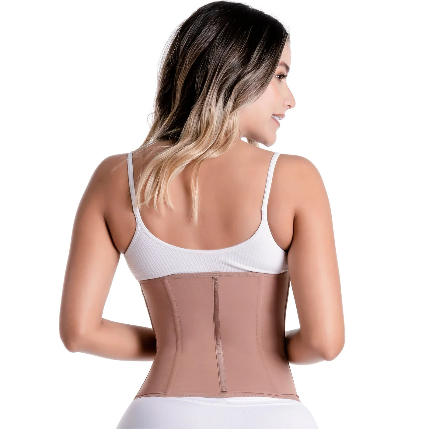 Woman wearing a beige waist trainer with a white background