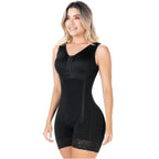 Woman wearing a black compression garment on a white background