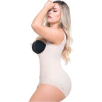 Woman wearing a white bodysuit with lace details on a white background