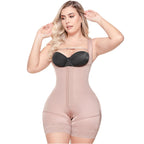 Woman wearing a beige shapewear garment on a white background
