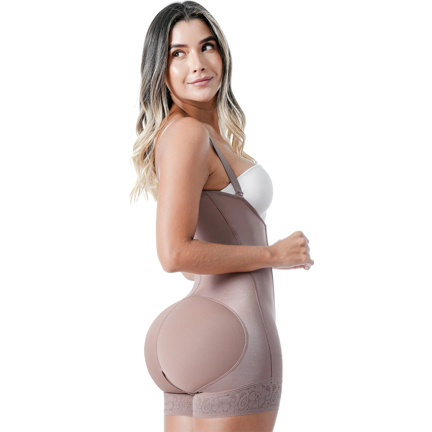 Woman wearing a beige body shaper against a white background