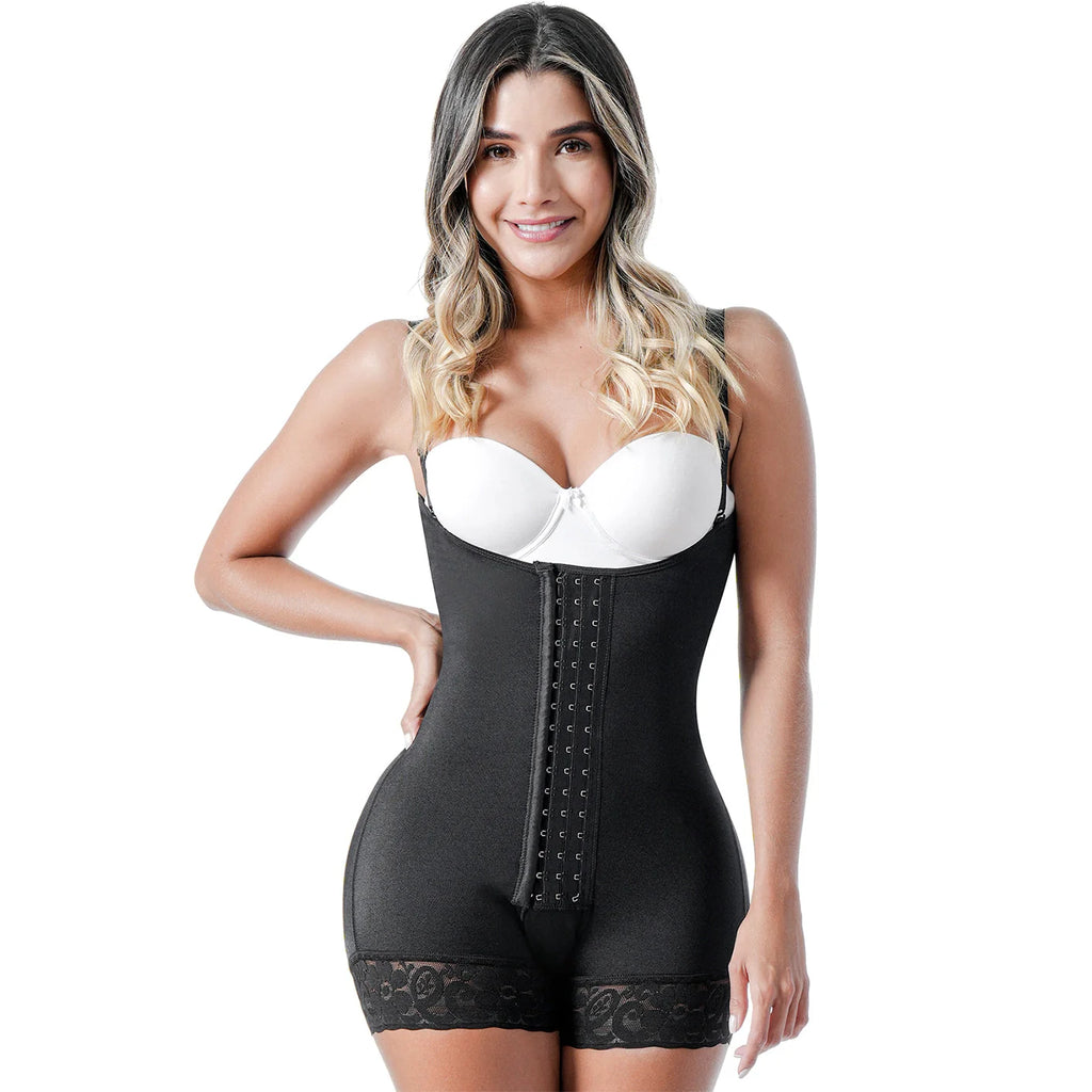 Woman wearing a black waist trainer with a white bra on a white background