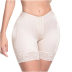 White shapewear shorts with lace trim on a white background