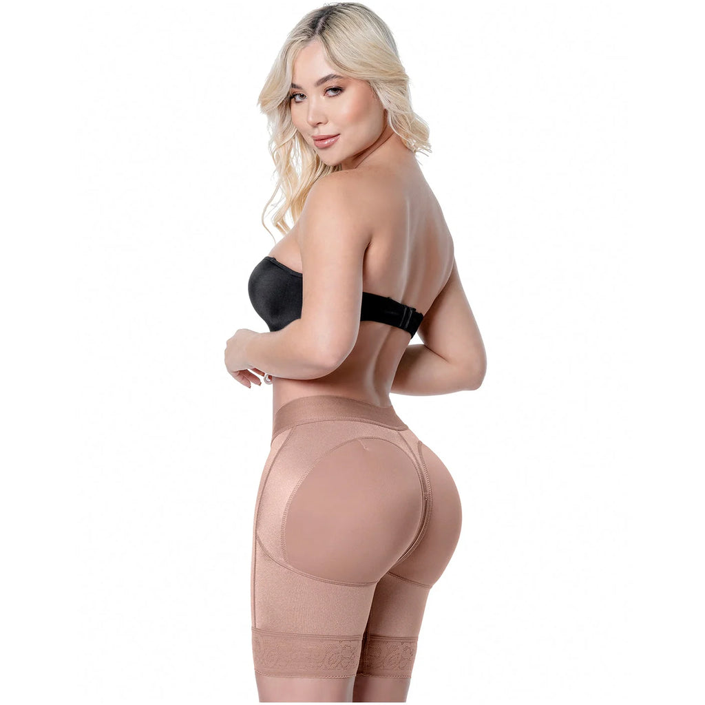 Woman wearing a beige shapewear garment on a white background