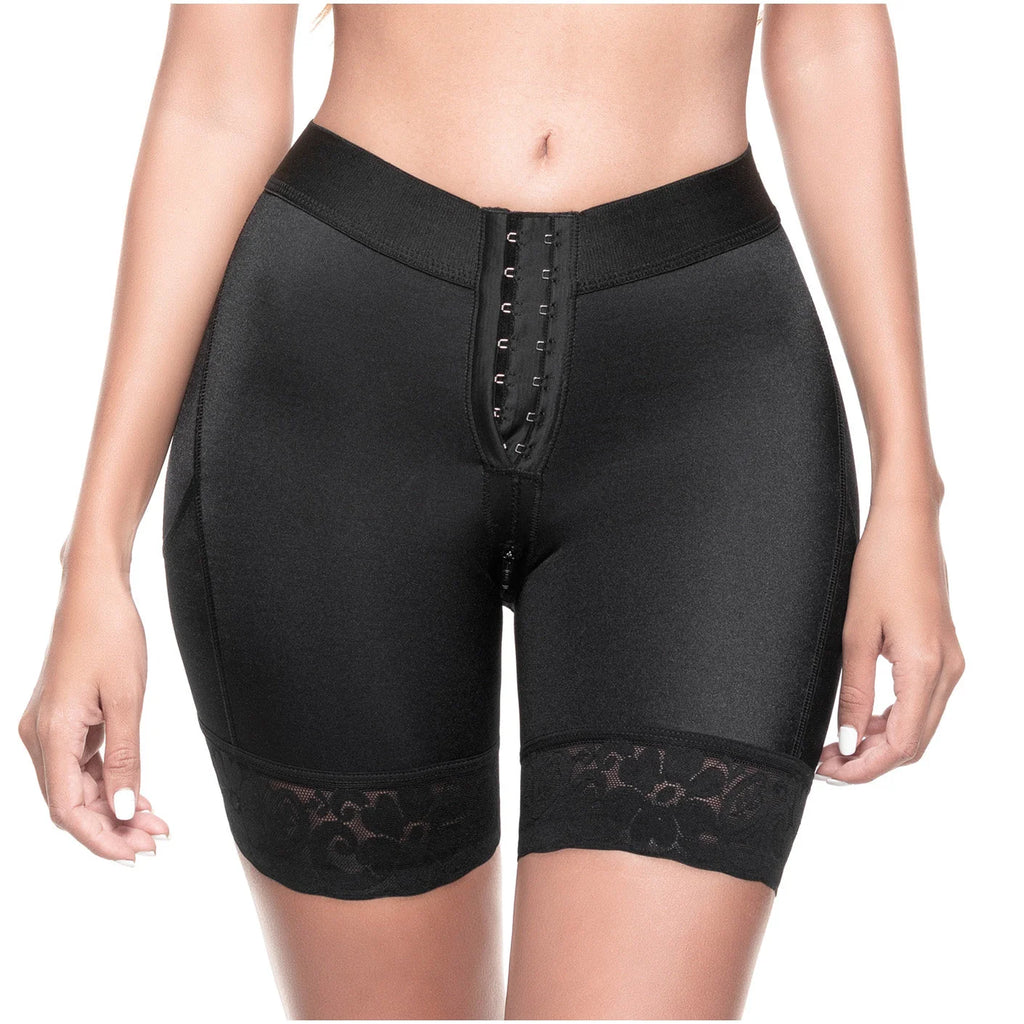 Black shapewear shorts with lace trim on a white background