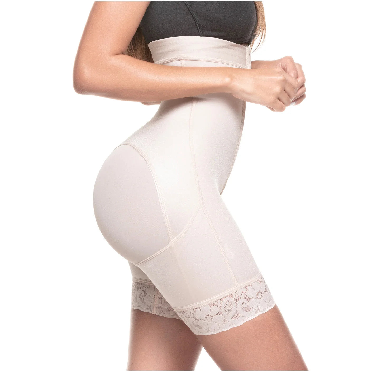 White shapewear garment worn by a person on a white background