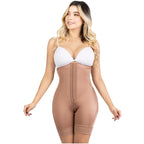 Woman wearing a beige shapewear bodysuit on a white background
