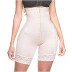 Beige shapewear with lace trim worn by a person on a white background