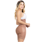 Woman wearing a beige shapewear garment on a white background