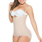 Woman wearing a beige shapewear bodysuit on a white background