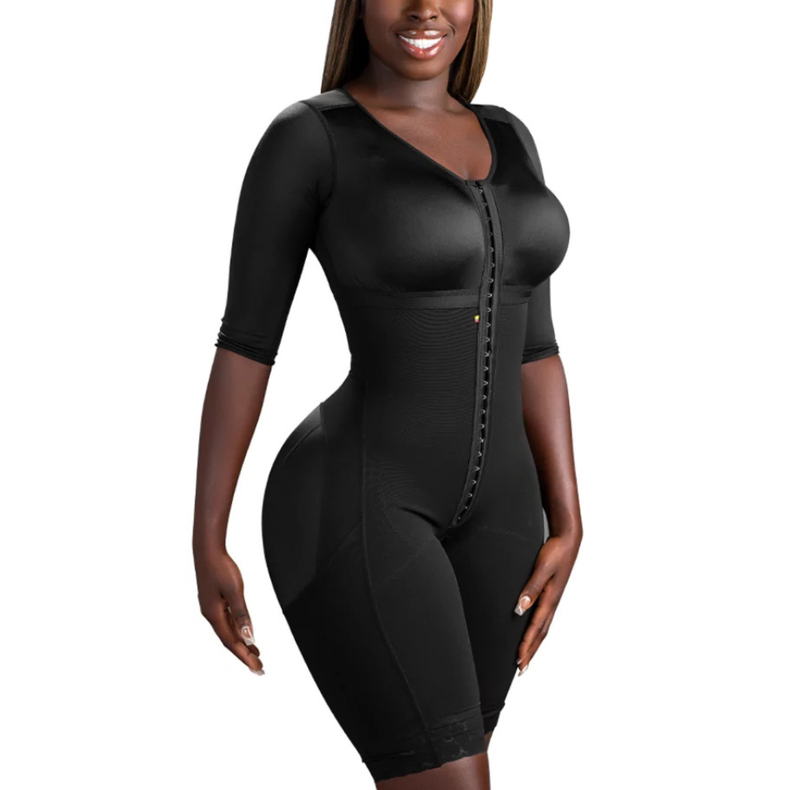 Woman wearing a black body shaper against a white background
