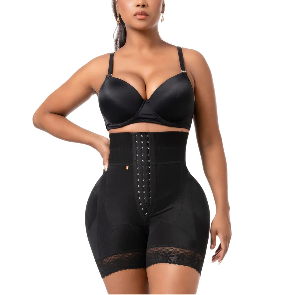 Woman wearing a black shapewear bodysuit on a white background