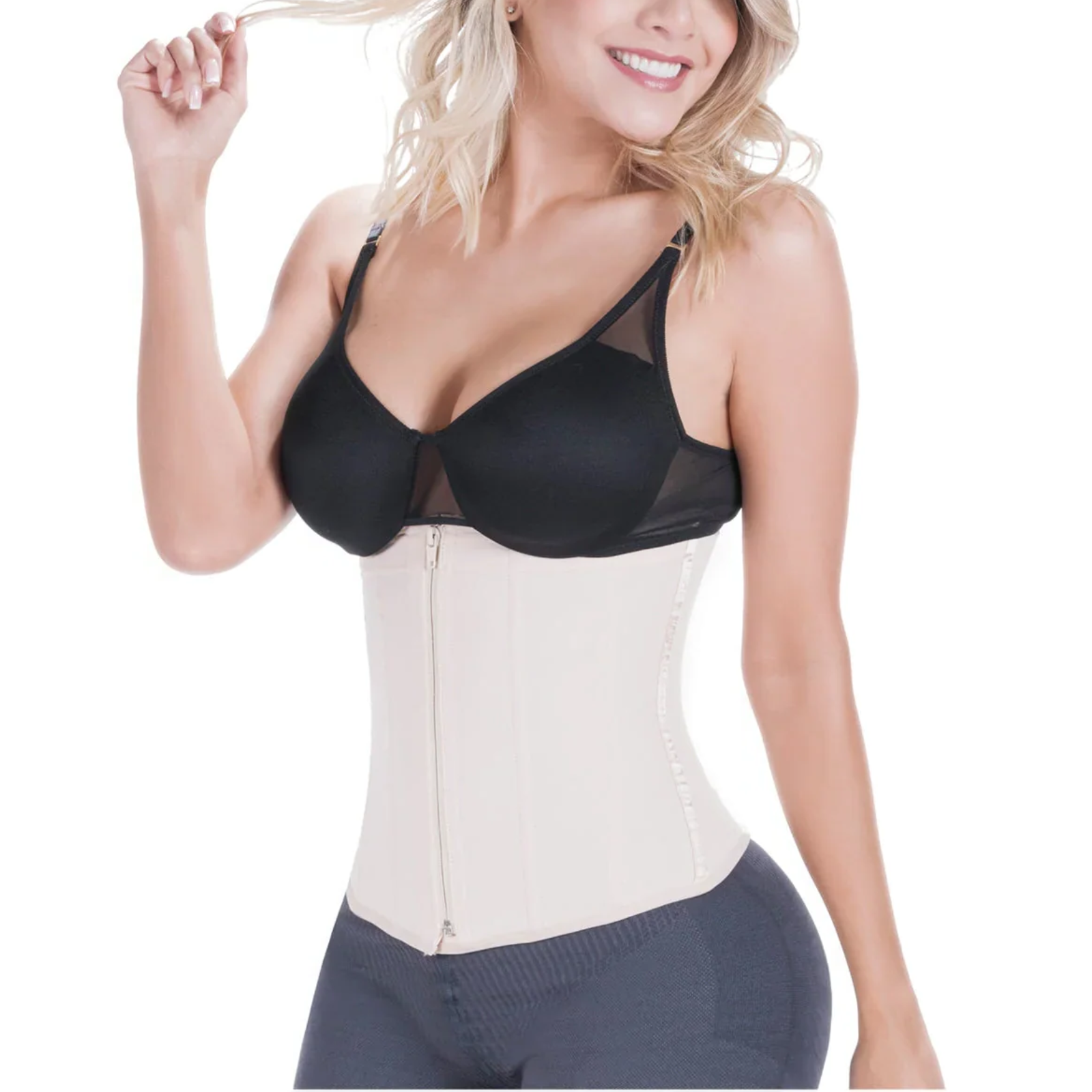 Woman wearing a black bra and beige waist trainer on a white background