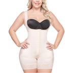 Woman wearing a white shapewear garment with a black bra on a white background