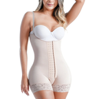 Woman wearing a beige shapewear garment with a white bra on a white background