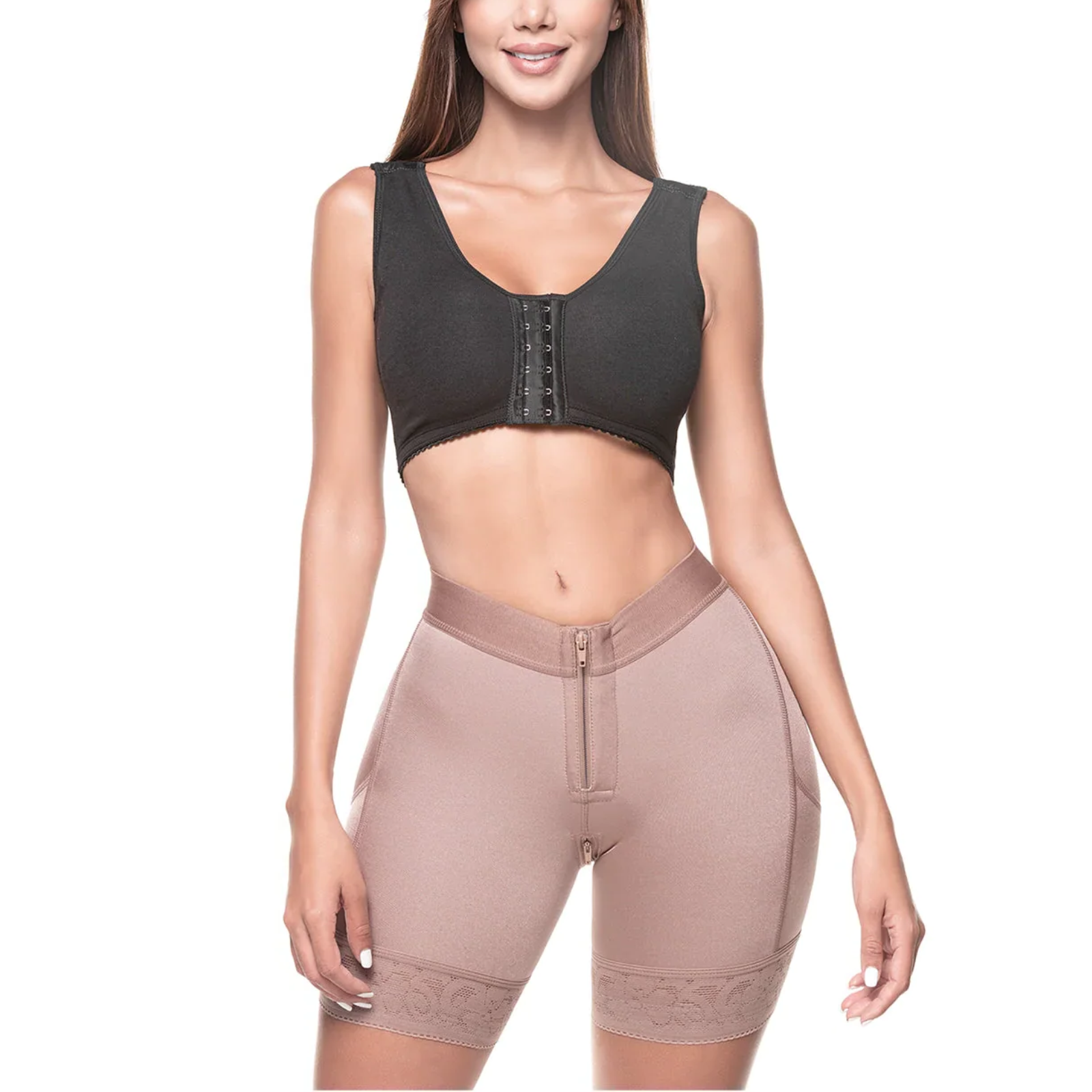 Woman wearing a black sports bra and beige compression shorts on a white background