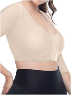 Beige crop top worn by a person on a white background