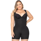 Woman wearing a black shapewear bodysuit on a white background