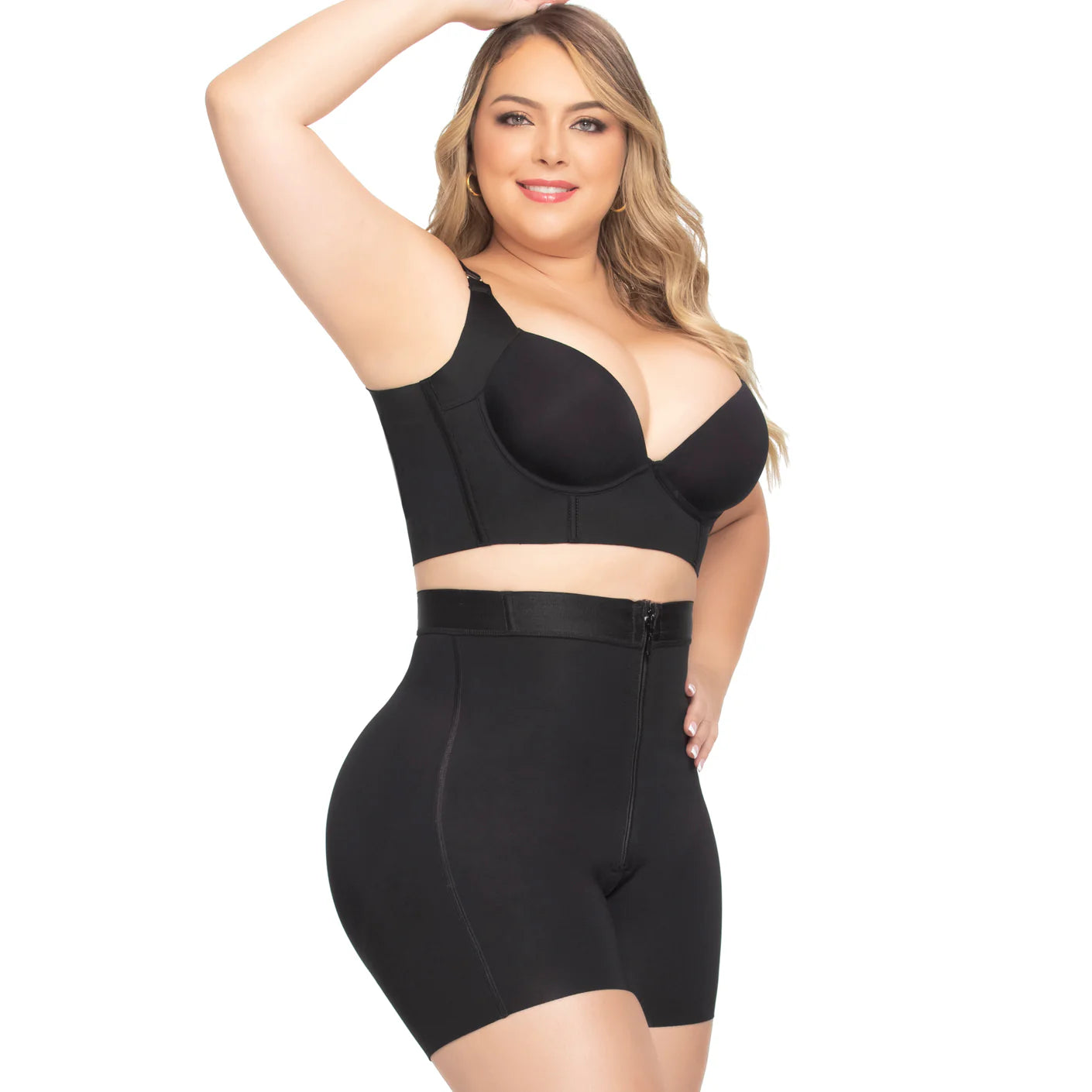Woman wearing a black shapewear outfit on a white background