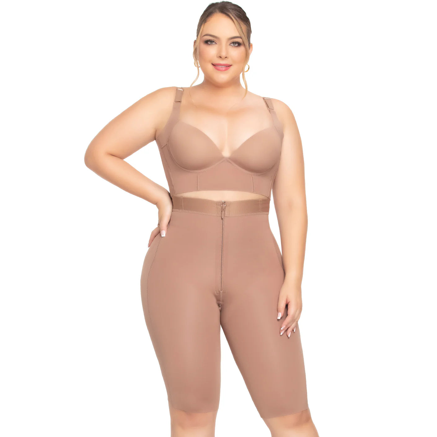 Woman wearing a beige shapewear jumpsuit on a white background