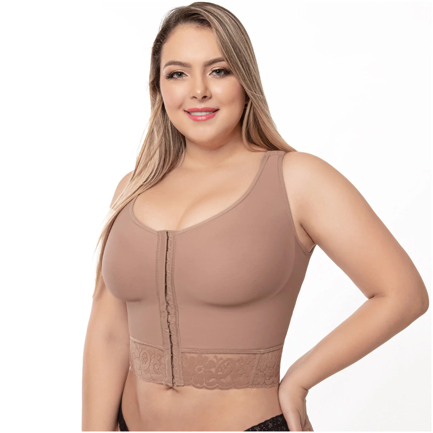 Woman wearing a beige compression garment on a white background