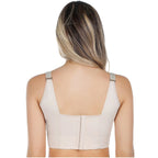 Beige back support brace worn by a person on a white background