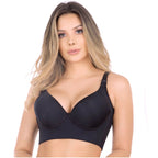 Woman wearing a black bra on a white background
