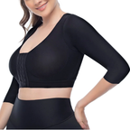 Black athletic top worn by a person on a white background