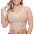 Woman wearing a beige compression garment on a white background