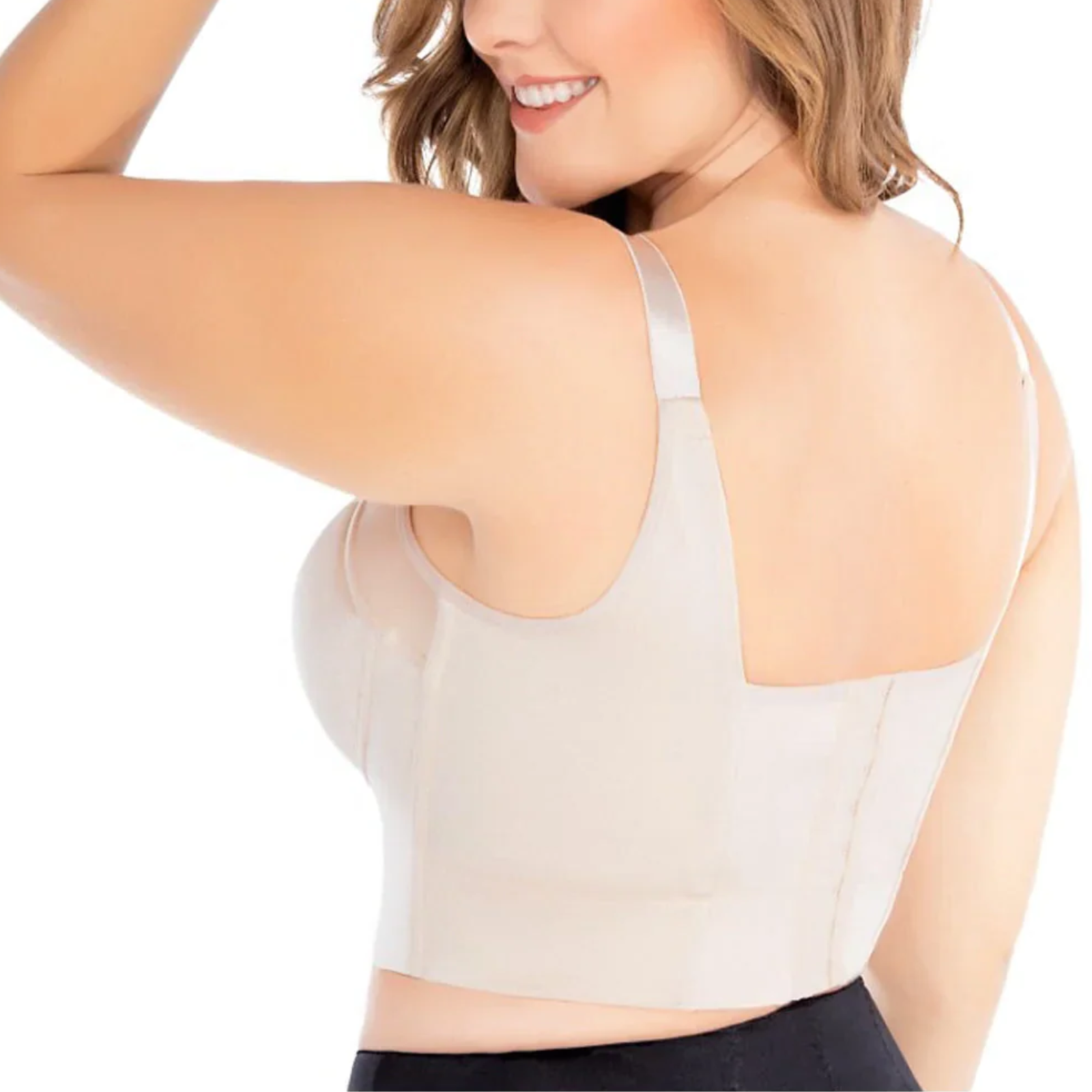 Woman wearing a beige tank top with thin straps on a white background