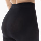 Black shapewear garment on a white background