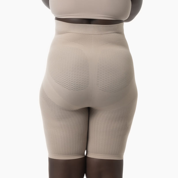 Beige shapewear garment on a white background