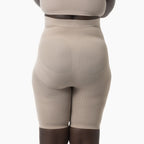 Beige shapewear garment on a white background