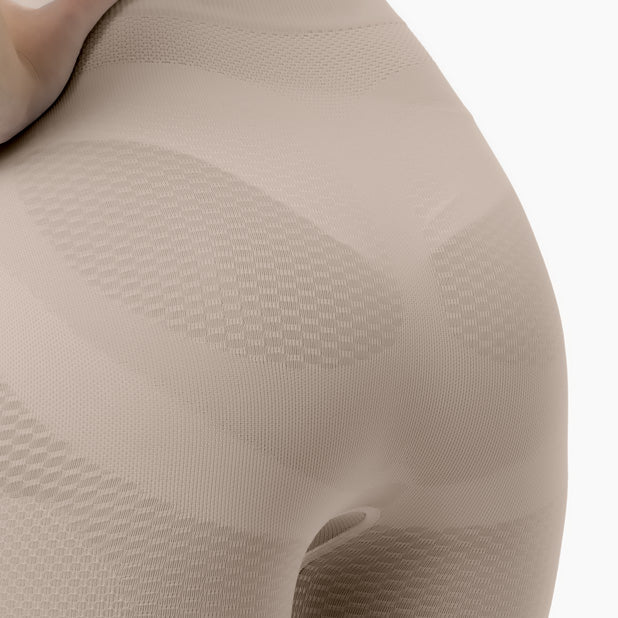 Close-up of beige textured fabric on a white background