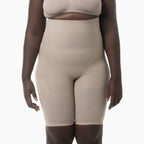 Beige shapewear worn by a model on a white background