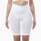 White high-waisted shapewear shorts on a white background