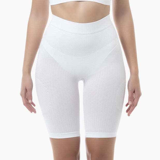 White high-waisted shapewear shorts on a white background
