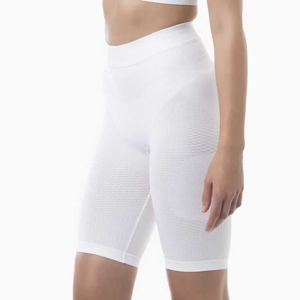 White compression shorts worn by a person on a white background