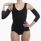 Person wearing a black bodysuit with long-sleeve arm covers on a white background