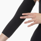 Black arm sleeve worn on a white background