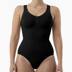 Black bodysuit worn by a model on a white background