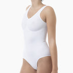White bodysuit worn by a person on a white background