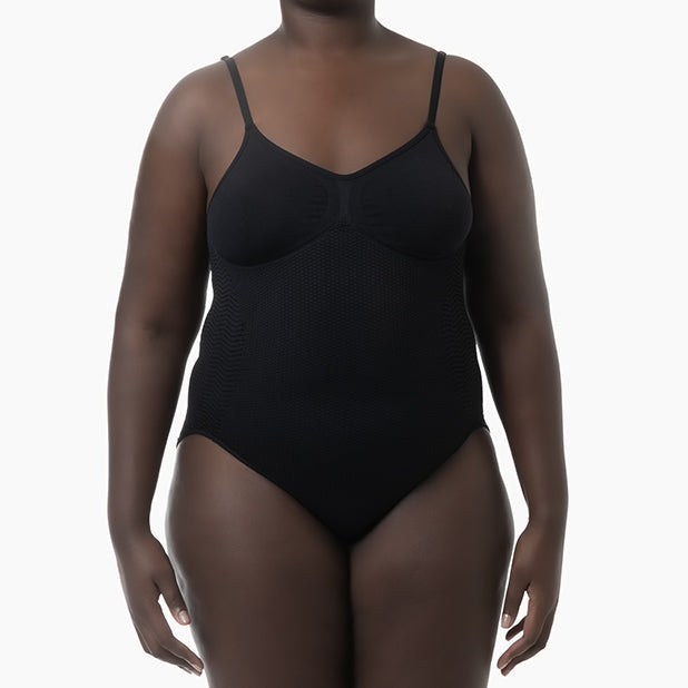Black one-piece swimsuit worn by a model on a white background