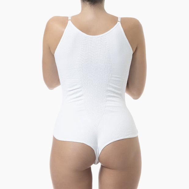 White ribbed tank top worn by a person on a white background