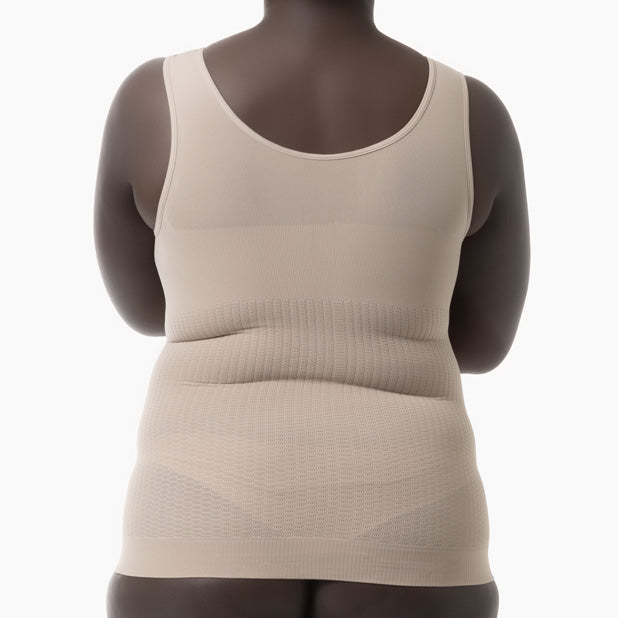 Beige tank top worn by a mannequin on a white background