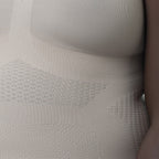 Close-up of a textured gray garment with a subtle pattern.