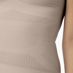 Close-up of a beige shapewear garment with textured pattern