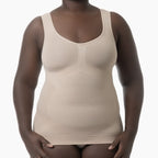 Beige compression tank top worn by a model on a white background