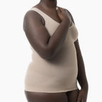 Woman wearing a beige compression garment on a white background