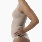 Beige compression garment worn by a person on a white background